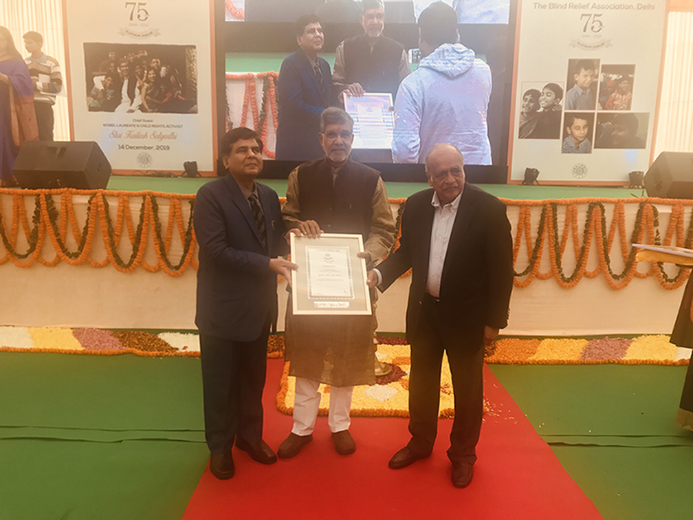 Prof. Anil K. Aneja receiving the award for his special achievements from Nobel Laureate and Activist Kailash Satyarthi (2019)